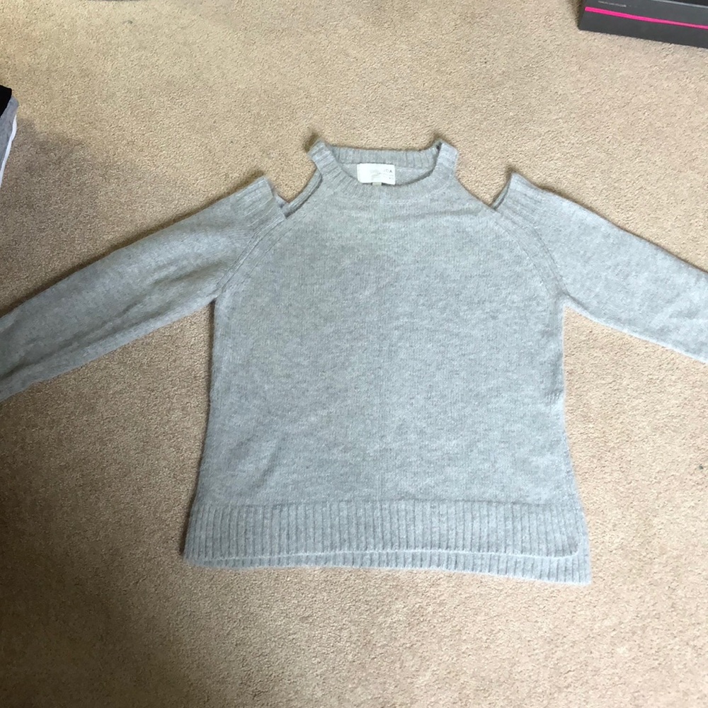 Light grey cold shoulder sweater.